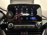 someone is taking a picture of a car dashboard with their cell phone