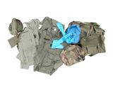 a pile of military clothing on a white surface