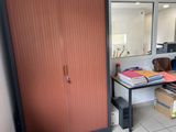 a room with a desk and a mirror in it