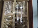 a lot of spoons and forks in a drawer
