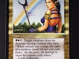 a close up of a card with a picture of a woman holding a scythe