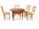 four chairs around a table with a wooden table and chairs