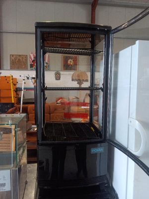 a refrigerator that has a glass door in it