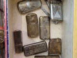 a box with a bunch of old lighters inside of it