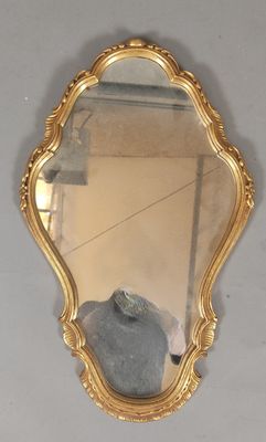 a mirror that is hanging on the wall in the room