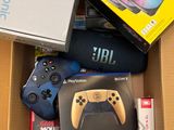 a box full of electronic gadgets and a game controller