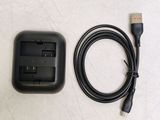 a charger and a cable connected to a charger on a table