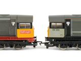 two trains that are sitting side by side on the tracks