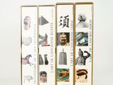 three books are stacked on top of each other on a white surface
