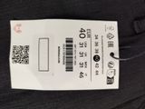the label on the back of a pair of black jeans