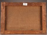 an old wooden frame with a label on it