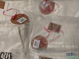 four bags of cookies that are wrapped in plastic bags