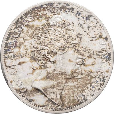 a close up of a coin with a woman ' s head on it