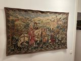 a tapestry hanging on the wall of a room