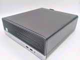 an image of a silver computer sitting on top of a white surface