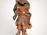 a statue of a man holding a torch in his hand
