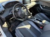the interior of a car with a steering wheel and dashboard controls