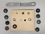 a picture of a knife, screws, and screws on a piece of paper