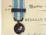 a medal with a medal on it sitting on a piece of paper