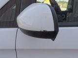 a side view of a white car with a side mirror