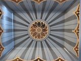 a picture of a decorative plate with a flower in the center