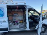 a white van that is parked in a parking lot