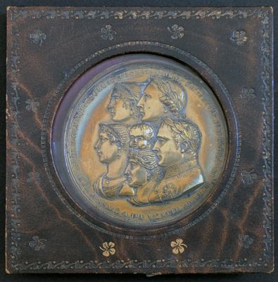 a plaque with a picture of a man and a woman on it