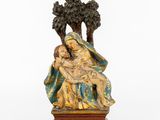 a statue of a woman holding a child in her lap