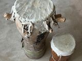 a drum and a drumet sitting on the floor