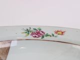 a close up of a plate with flowers on it