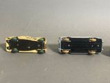 three miniature cars that are sitting next to each other