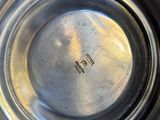 a close up of a metal bowl on a table