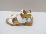 white leather sandals with buckles and buckles on the toes