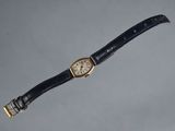a close up of a wrist watch with a black strap