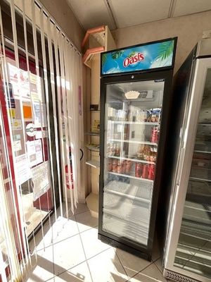 two refrigerators that are sitting in a store