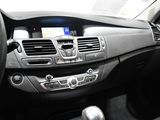 the interior of a car with a steering wheel and dashboard controls