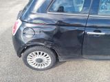 a small black car that has been damaged by a car accident