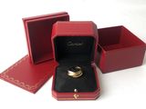 a red box with a gold ring inside of it