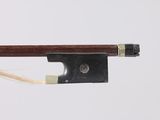 a close up of a violin bow on a white background
