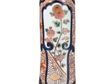 a vase that has a floral design on it