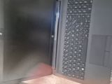 a laptop computer that is open on a table