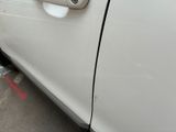 a close up of a car door handle on the side of the road