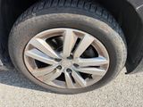 the tire of a car with a flat tire on the road