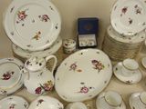 a lot of plates and cups and saucers on the table