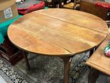 a table that has a lot of chairs around it