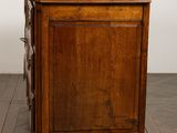 an image of a wooden chest of drawers sitting on top of a hard wood floor
