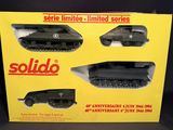 a box with three different models of military vehicles in it