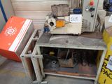 a machine that is sitting on a table in a garage
