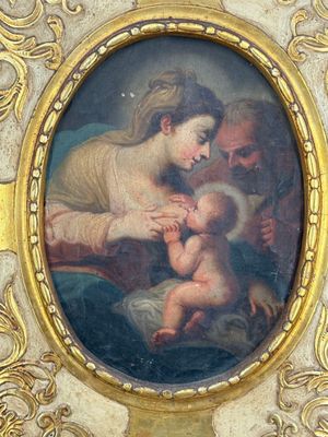une image d'une peinture représentant une femme tenant un bébé sur ses genoux