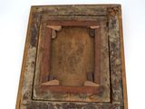 an old wooden picture frame with a picture in the middle